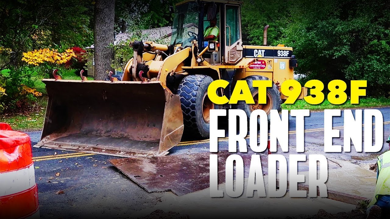 CAT 938F Wheel Loader placing a steel sheet over freshly poured CLSM flowable fill