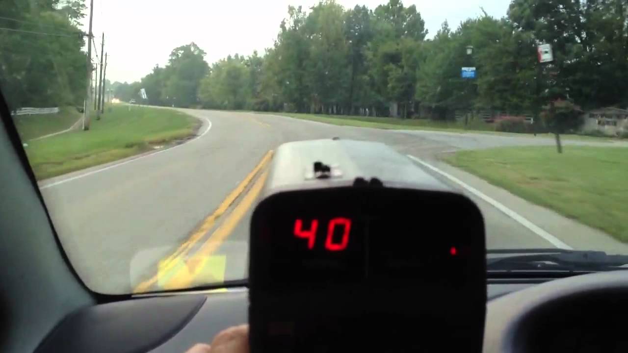 Kustom HR12 radar gun shown in use clocking cars in moving mode
