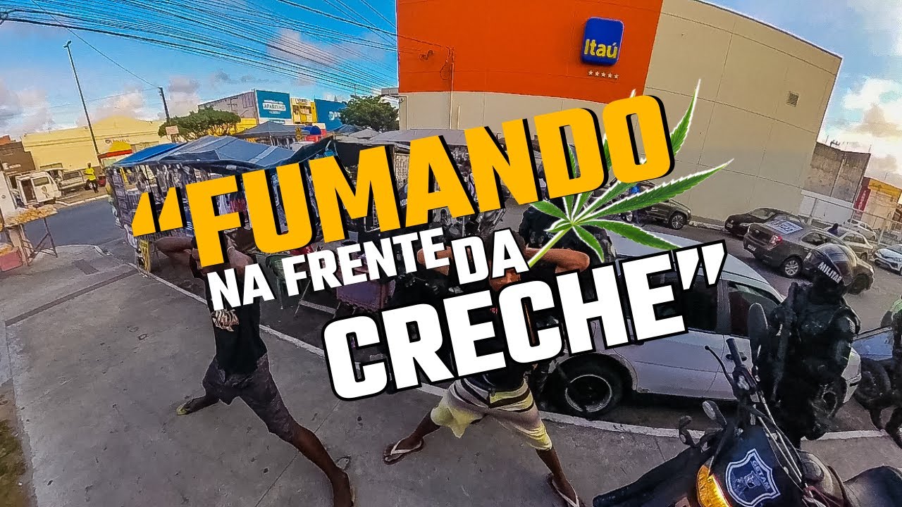FUMANDO a flor em frente a uma creche pública na cidade de socorro, GETAM em ação.