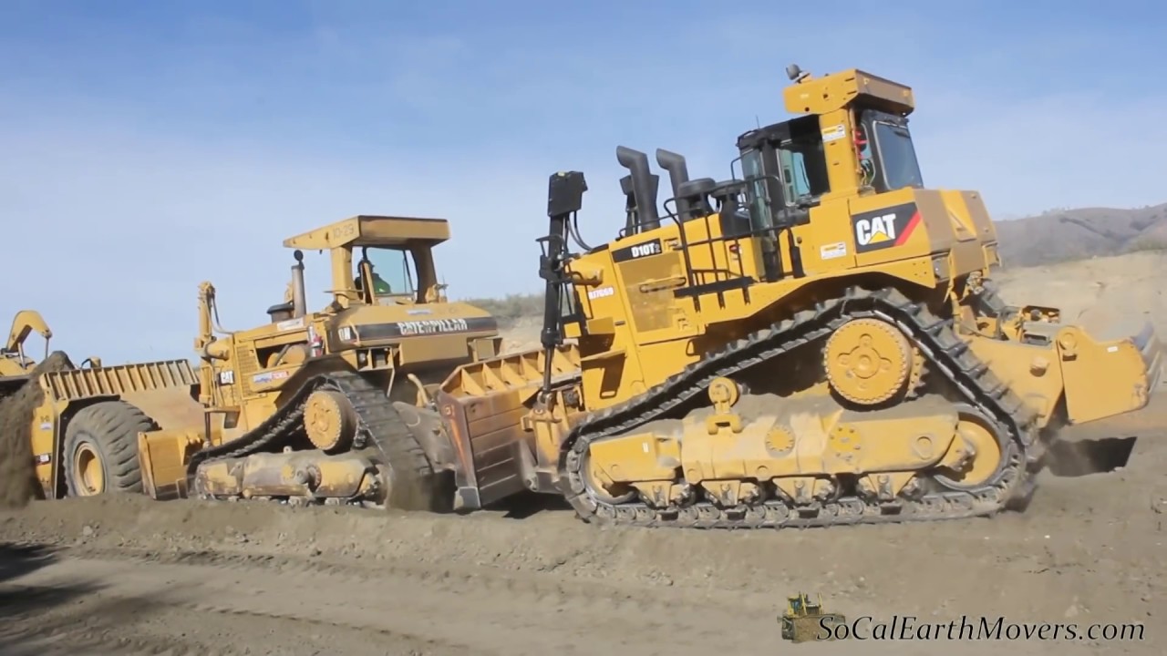 Cat's pushin cans... CAT D10N & D10T dozers push loading CAT 651B & 651E scrapers