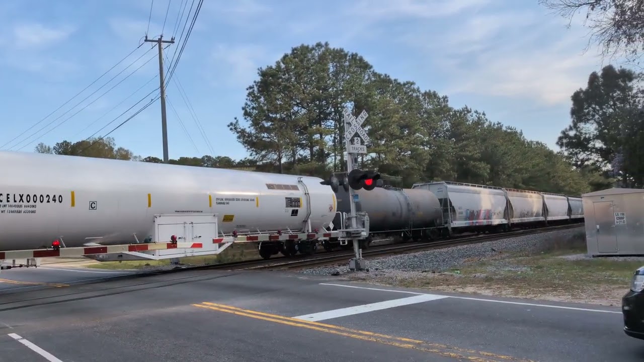 CSX 7234 and CSX 997 lead a nb mixed freight across Whitfield Street in Fayetteville 3/21/20