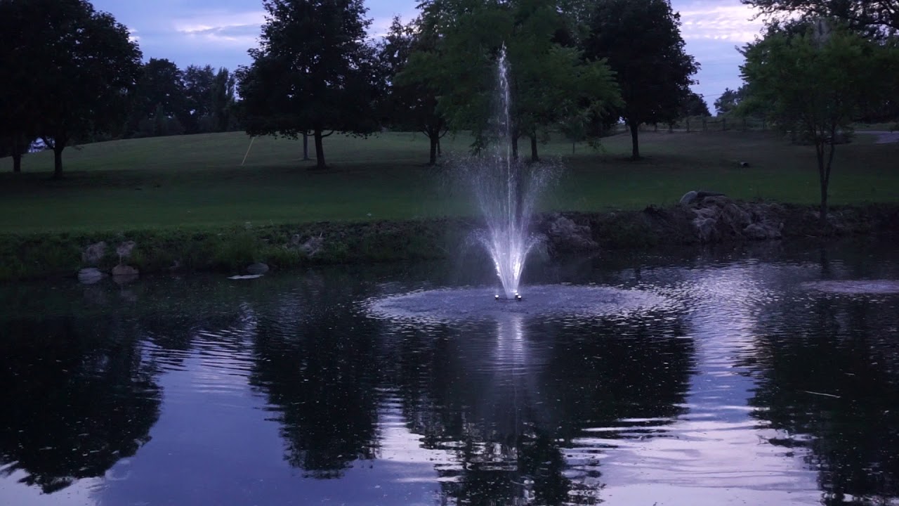 Oase 1/2 HP Floating Fountain with LED Lights at Dusk