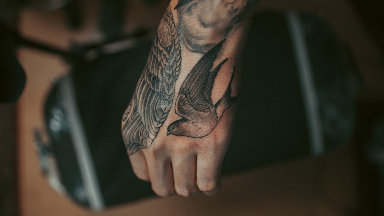 Swallows Hand Tattoo