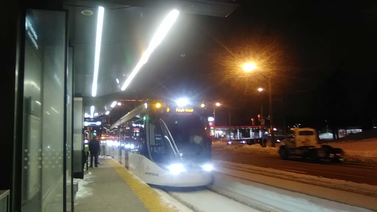 finch west lrt train at jane & finch stop eastbound to finch west station