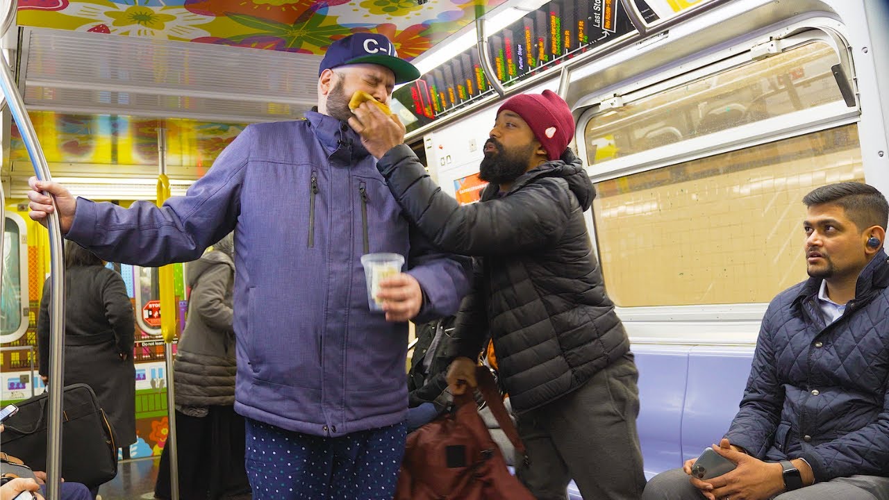Beating a Homeless Beggar on NYC Subway