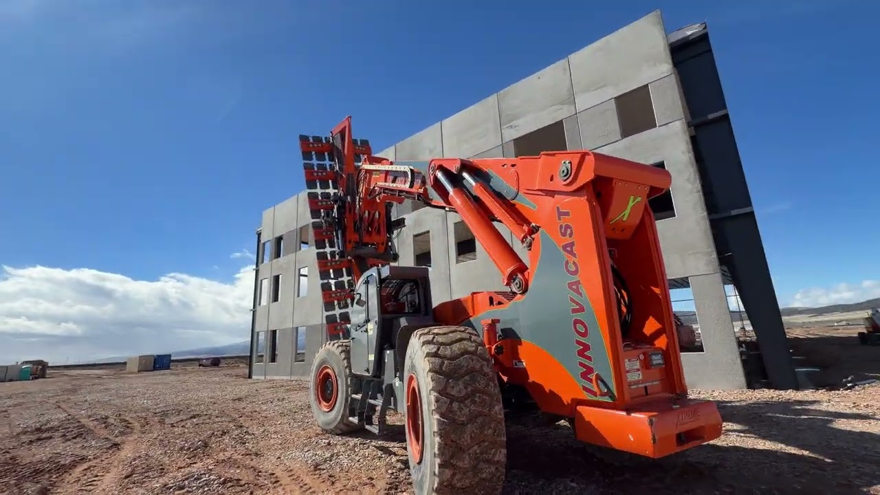 InnovaCast Concrete vacuum system setting up pre built panels on commercial building 70K forklift￼
