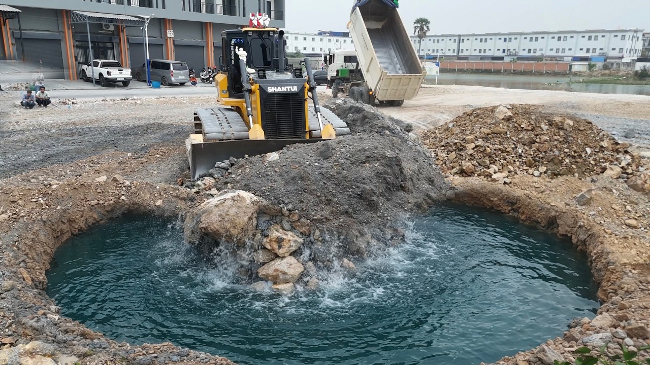 Awesome Land Filling Process Bulldozer Pushing Soil Mixed Stone Leveling Top ground