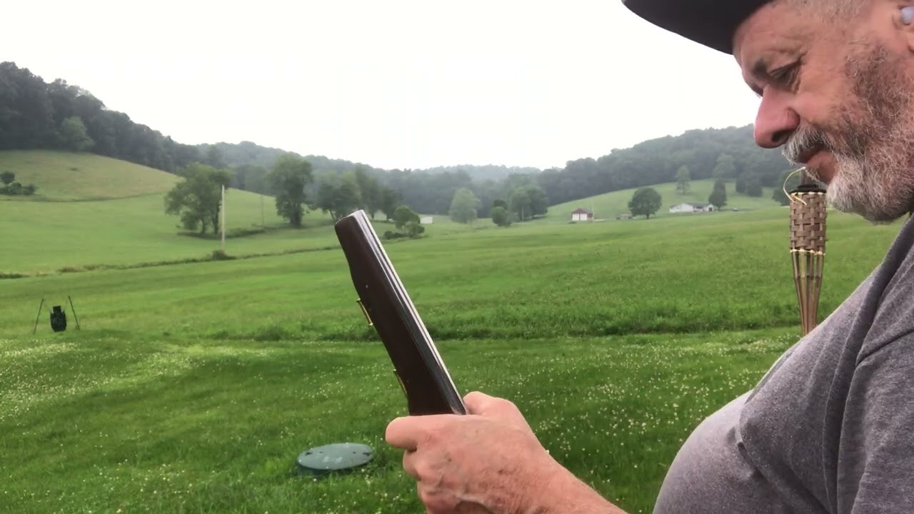 English dragoon flintlock pistol the heavy British model relaxing out side with the birds