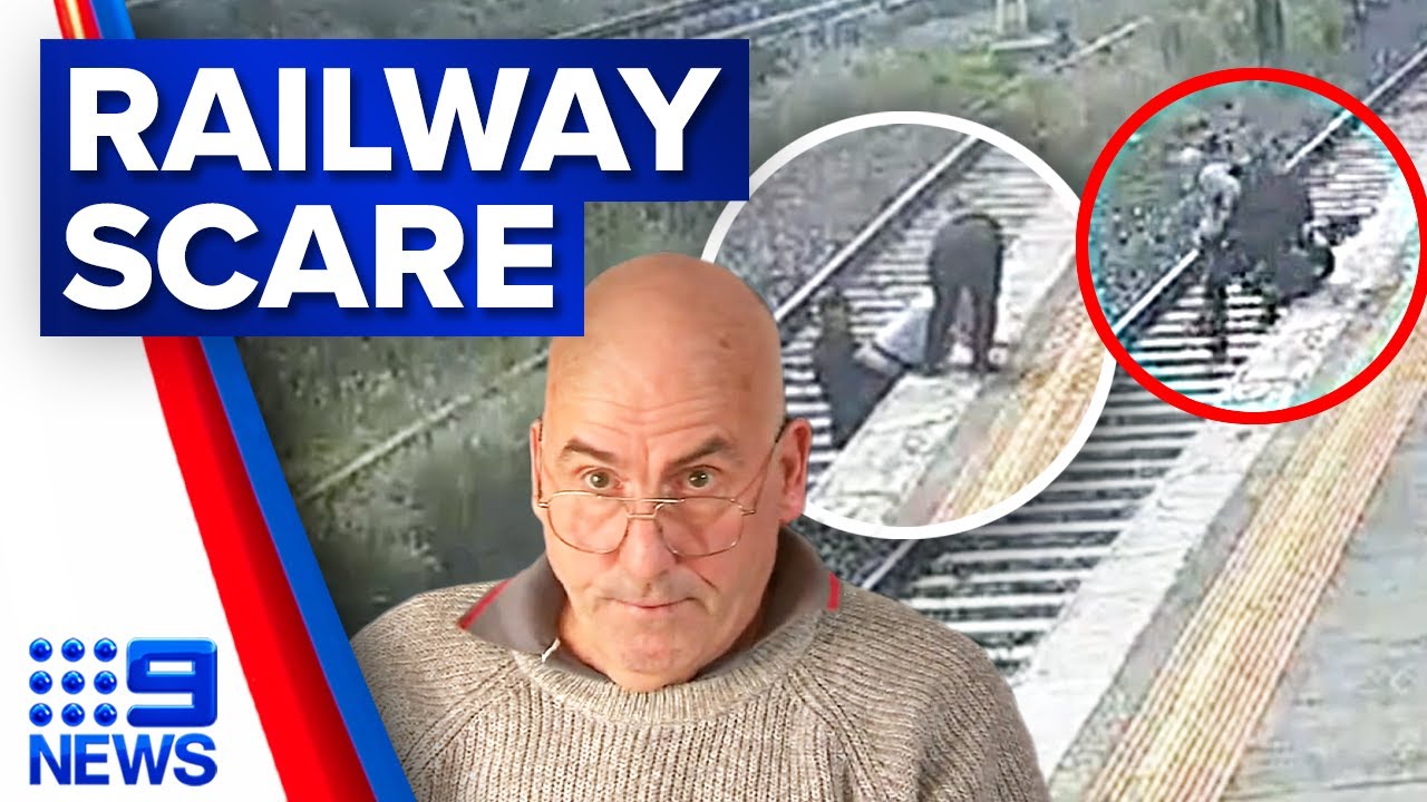 Man in wheelchair rescued from railway tracks after falling from platform | 9 News Australia