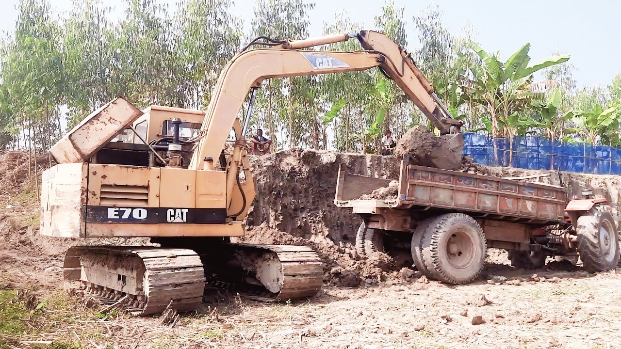 Excavator digs soil and loads it onto a truck part 6