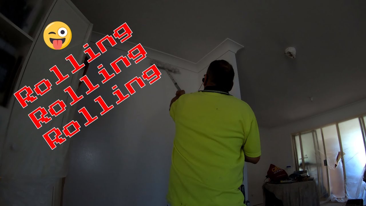 Final coat Roll Dulux wash and wear low sheen paint on walls