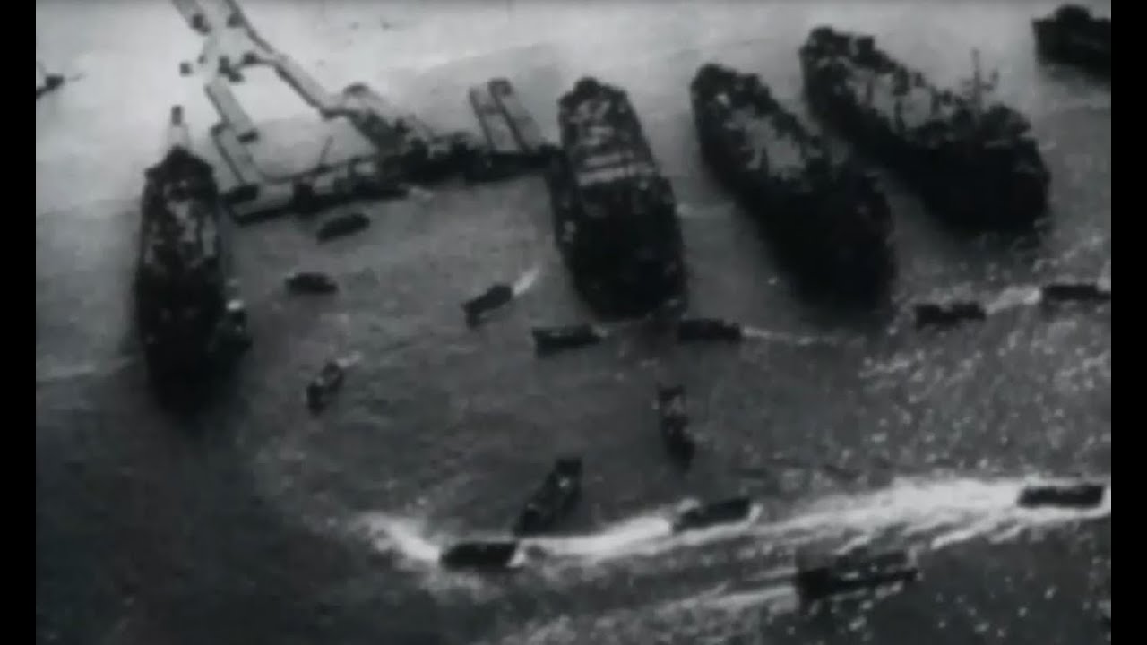 Okinawa US Navy Ships Pound Beach 10th Army Goes Ashore Aerial Beachhead Footage