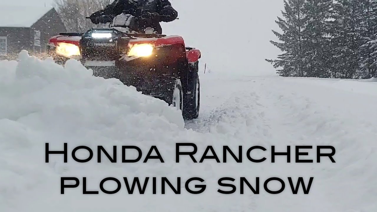 Rancher 420 plowing snow