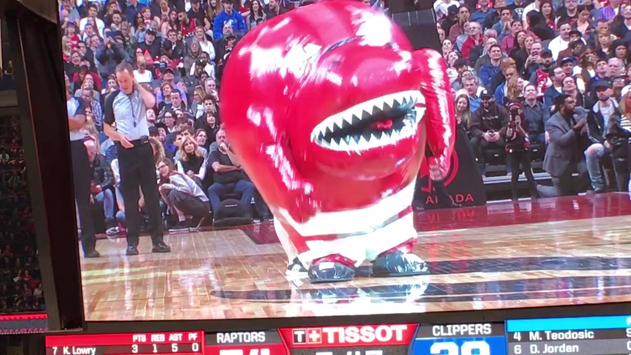 Raptor mascot swallows cheerleader