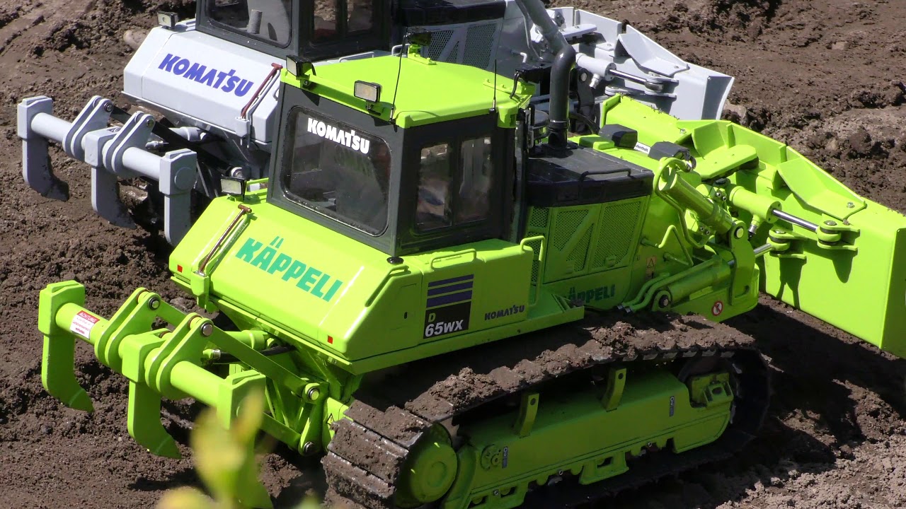 Komatsu D65 WX pushing topsoil