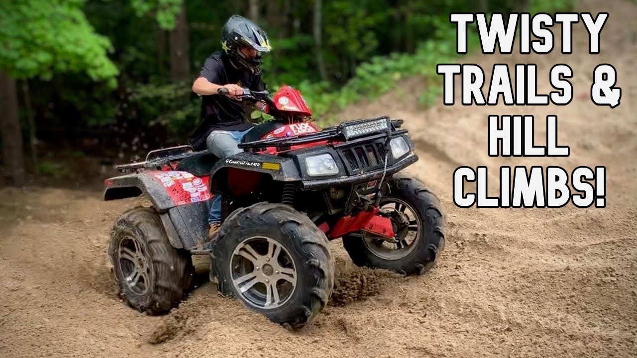 Arctic Cat on 28’s climbing steep sand hills & tight trails
