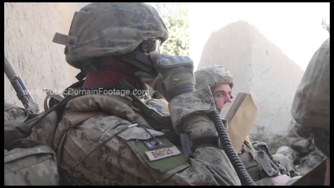 War in Afghanistan - Radio operator calling in air strike archival stock footage