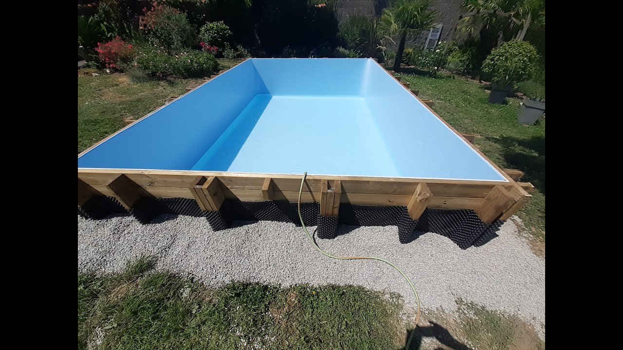 Pose d'une piscine bois semi-enterré Evora gré 620x400x133.Jardiscine.Paysagiste.Rives de L'yon