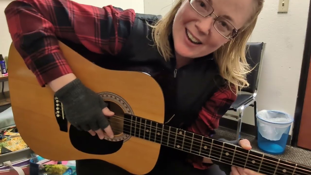 Strumming the guitar, up and down Lesson 1.1