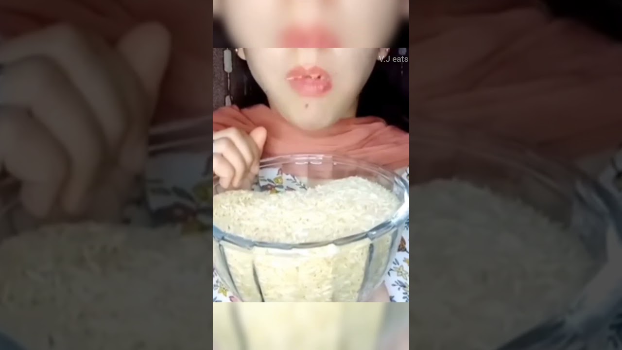 Raw rice eating with ( Hands )