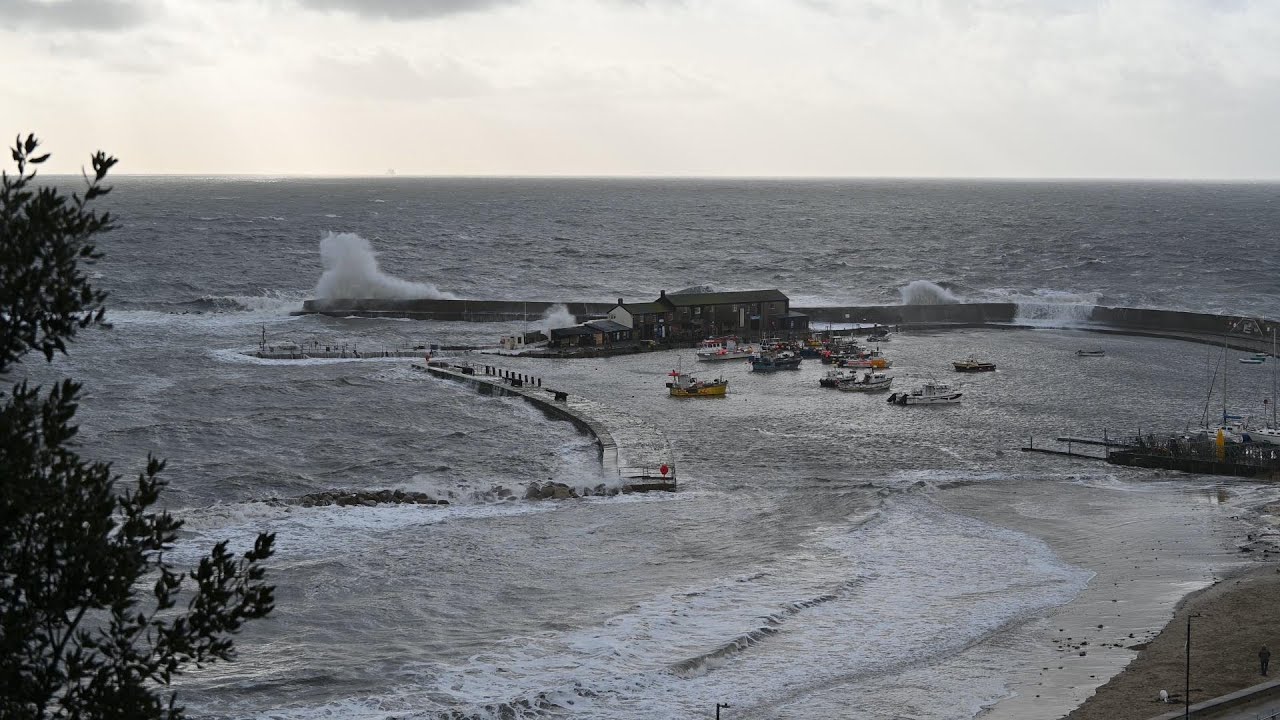 Storm Ingrid hits Lyme Regis with waves crashing against the Cobb 23/01/26