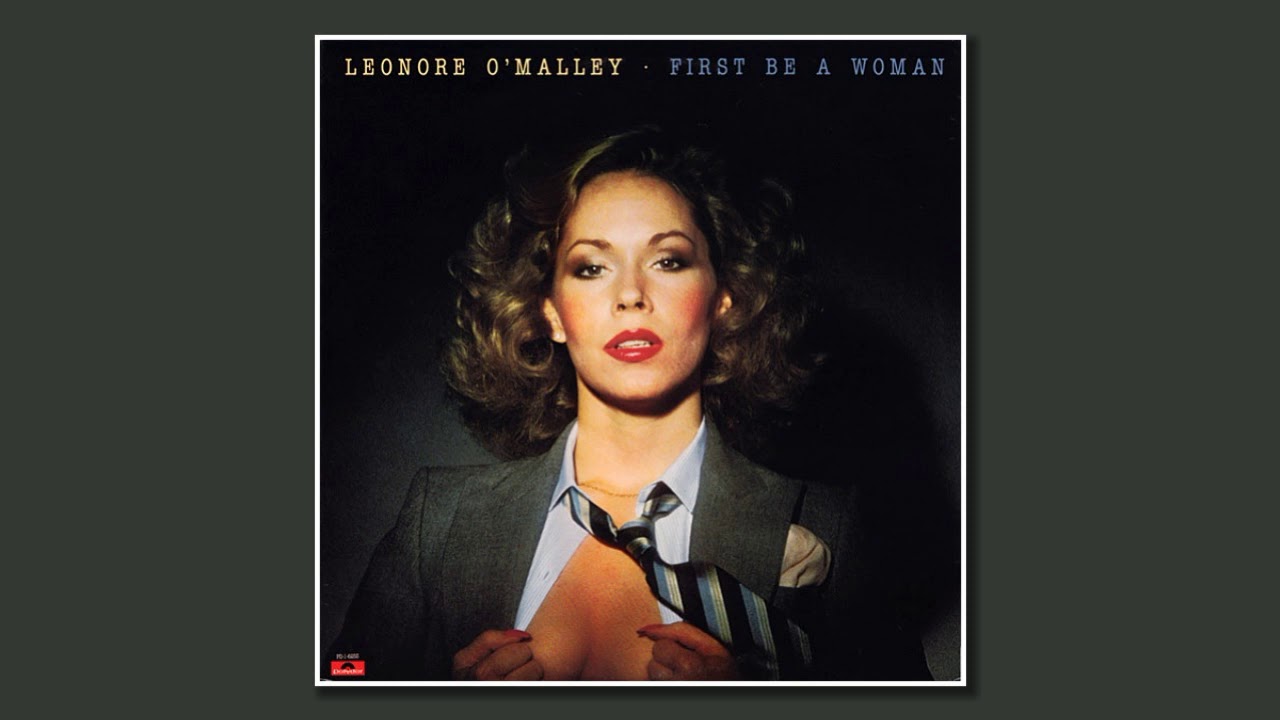 Leonore O'Malley - First Be a Woman