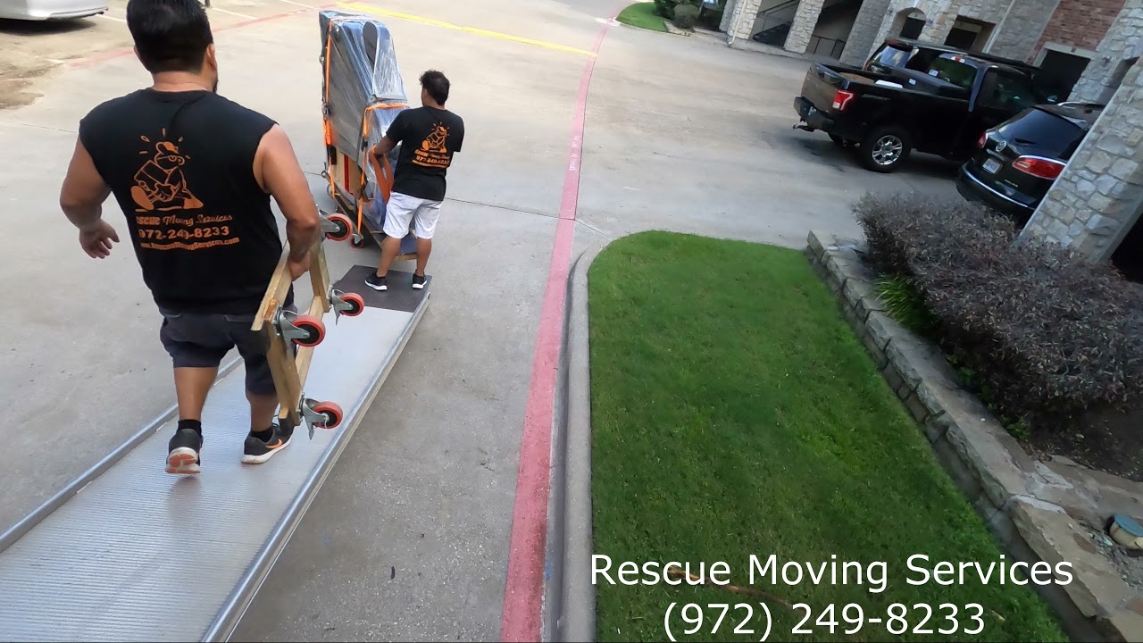 Moving a baby grand piano downstairs by Rescue Moving Services in Dallas | Piano Movers in Dallas