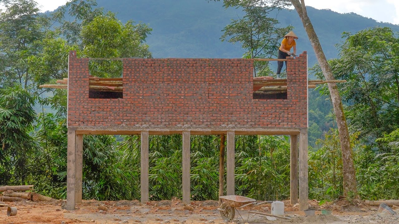The girl built the wall with 1000 red bricks - Roofed the house