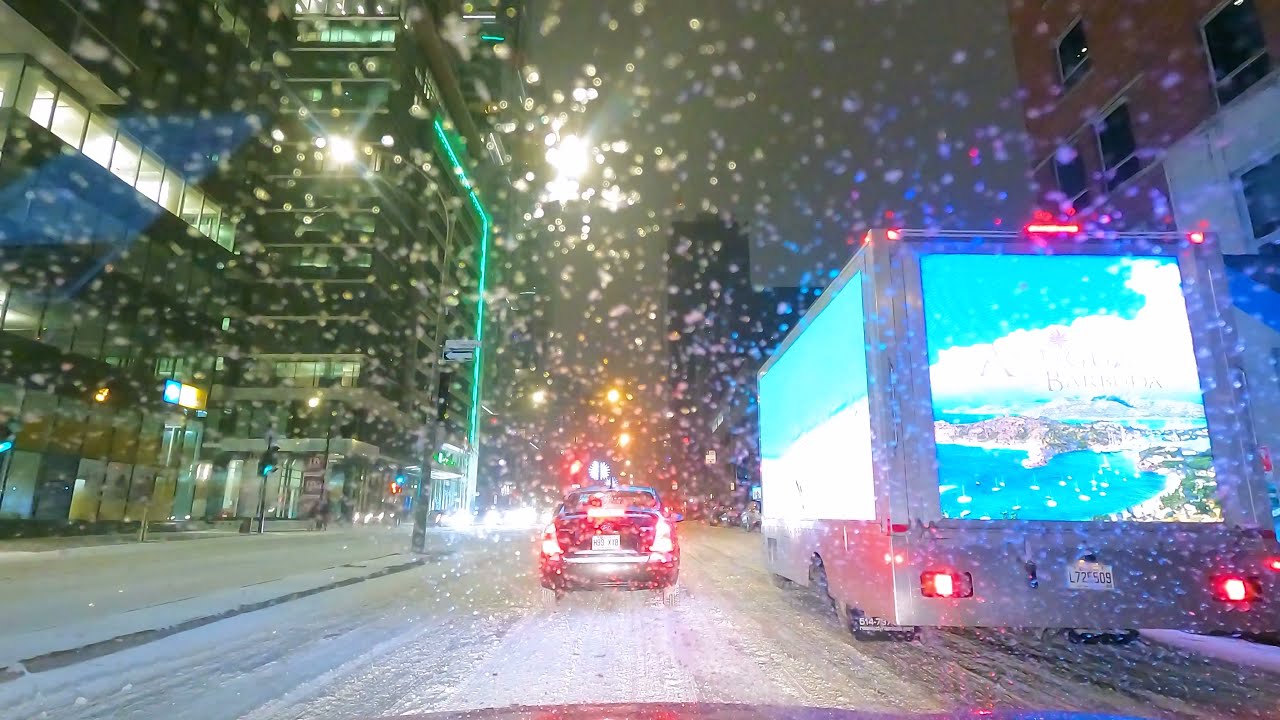MONTREAL DOWNTOWN IN SNOWY WINTER NIGHT