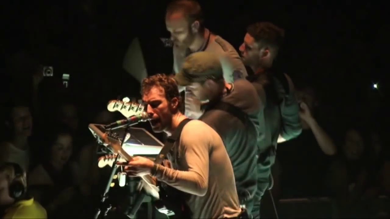 Coldplay performing the techno version of God Put a Smile Upon Your Face & Talk