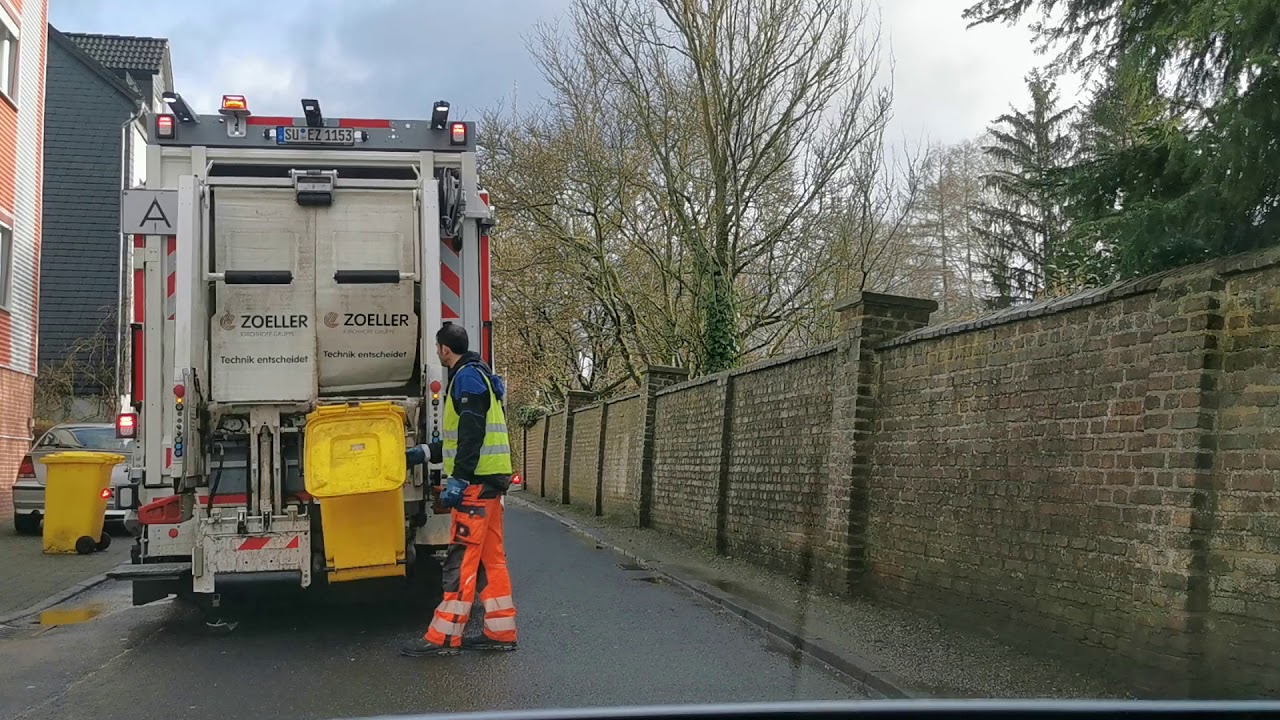 Garbage Truck in Germany #3 on Yellow Recycling bins.