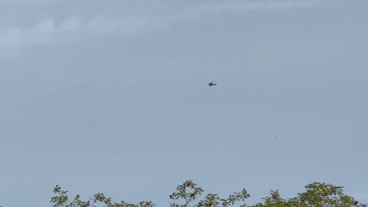 Private Aerospatiale AS350 [G-KLNM] flying above