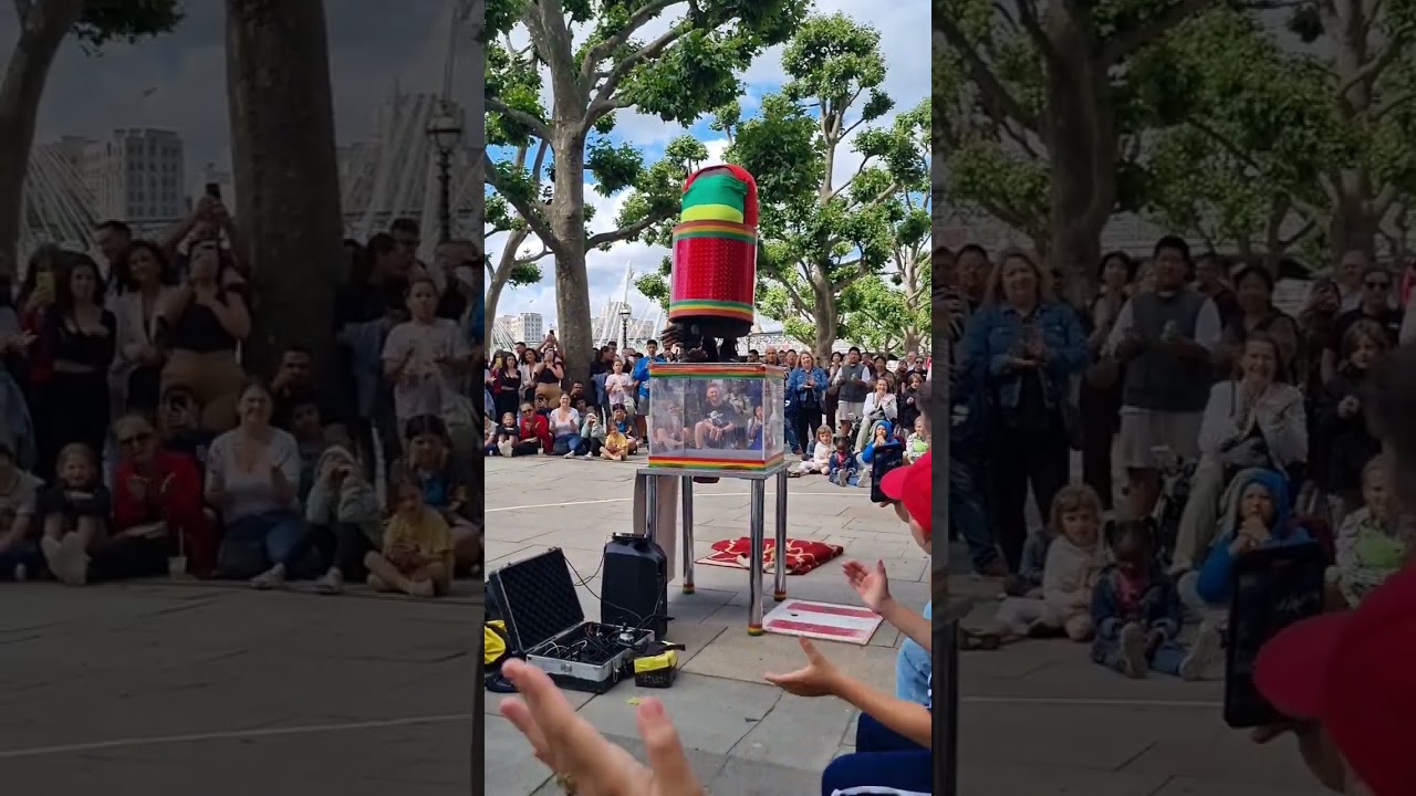 Guy fitting himself in tiny box - London