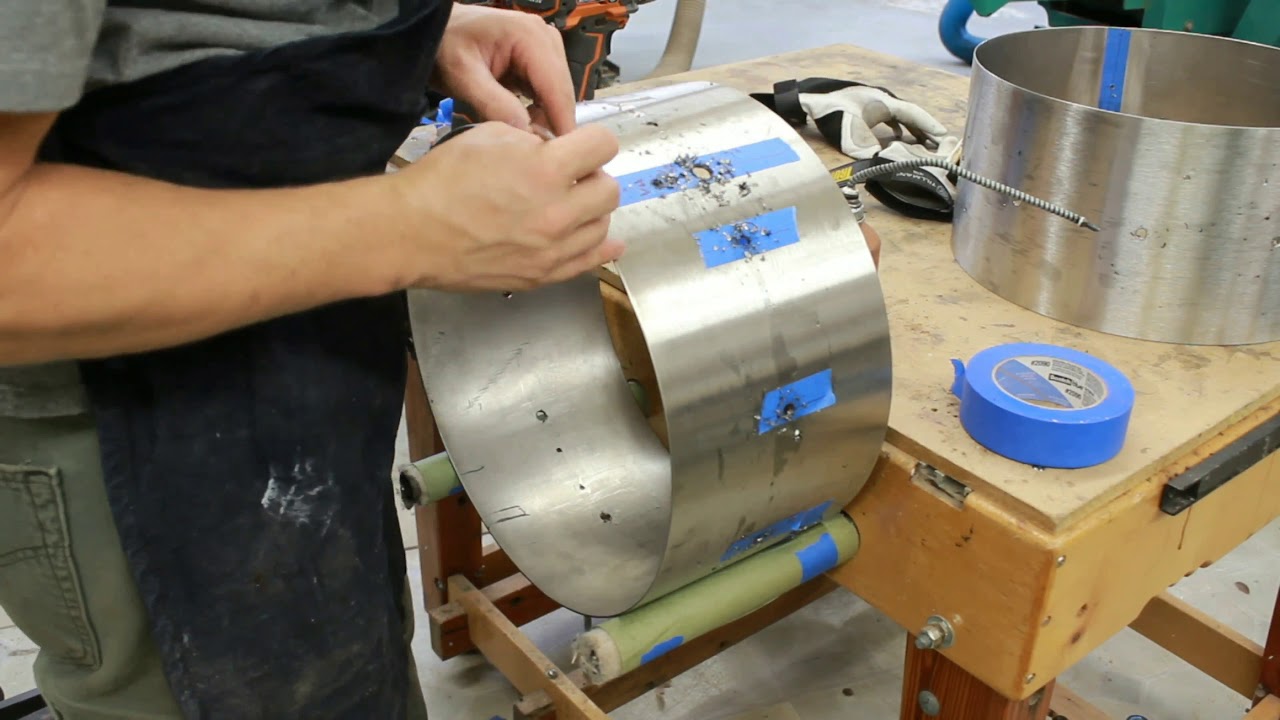 hand chamfering every hole in stainless steel prototype snare shells