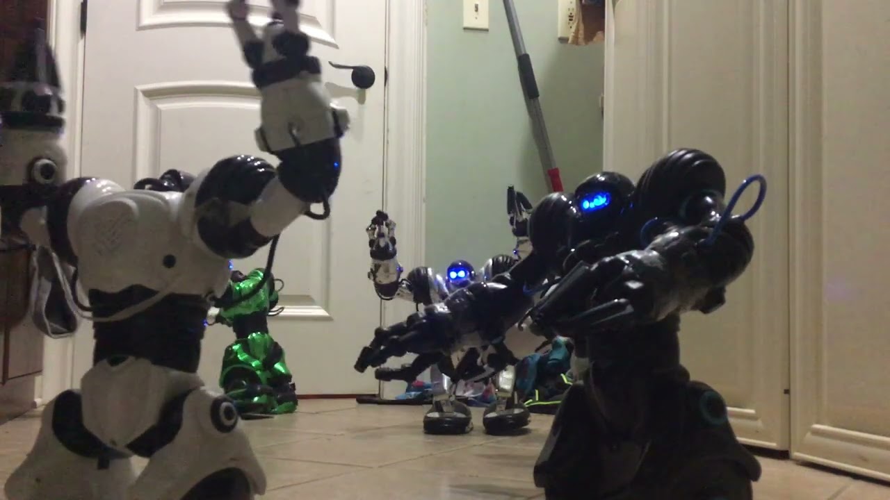 RoboSapien Blue learning to pick up cups