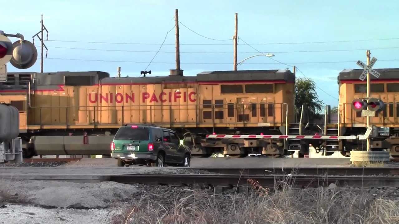 UP 9436 rock train preparing to stop in Rosenberg, TX