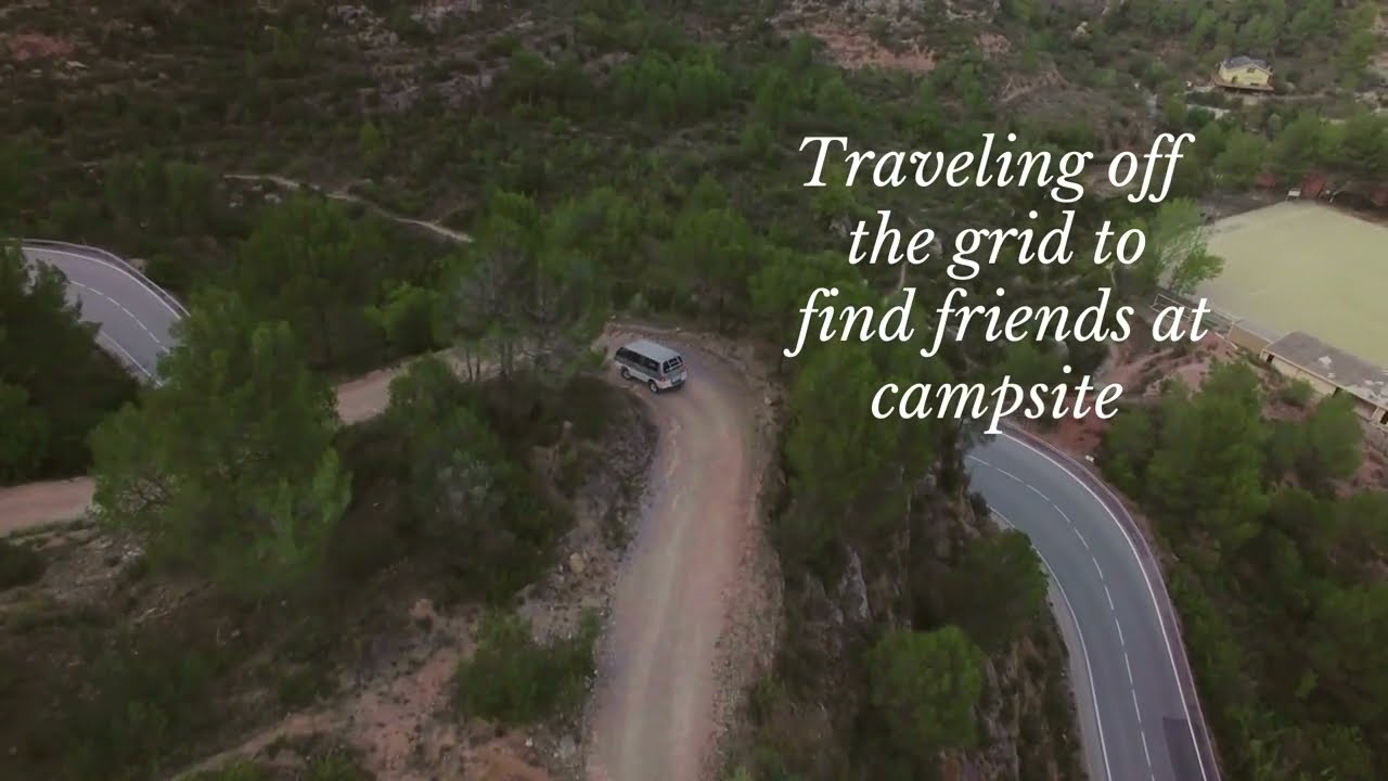 🏕️ Beautiful aerial drone shots of a camper at a lake in the mountains