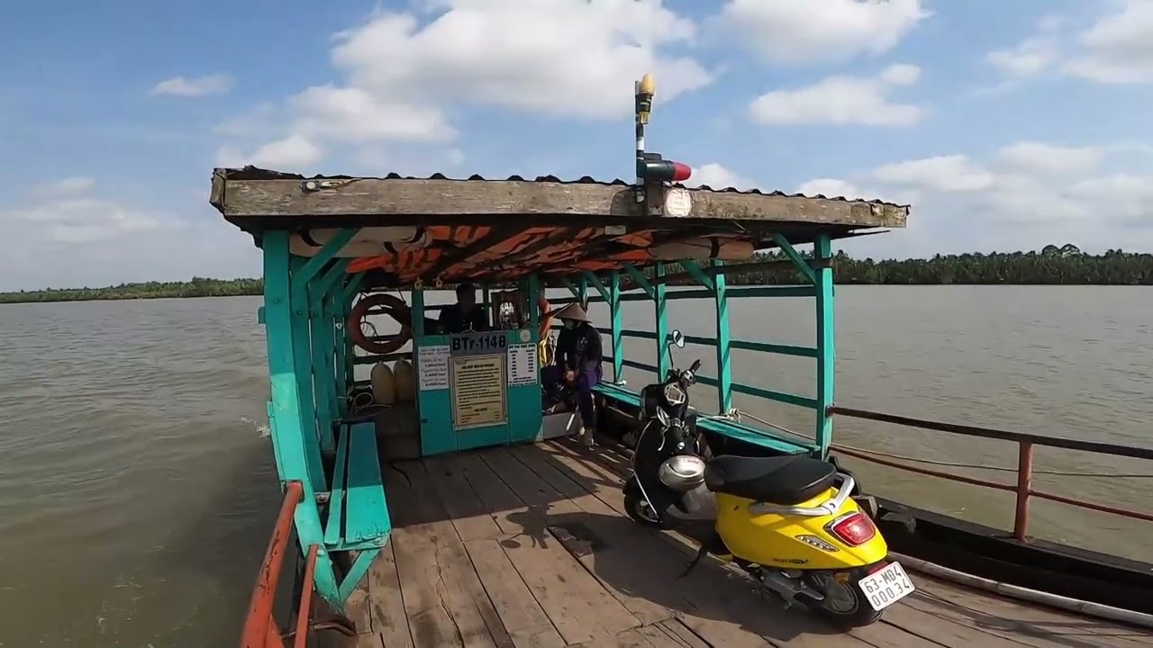 Riding the small ferry across the Mekong River in Vietnam