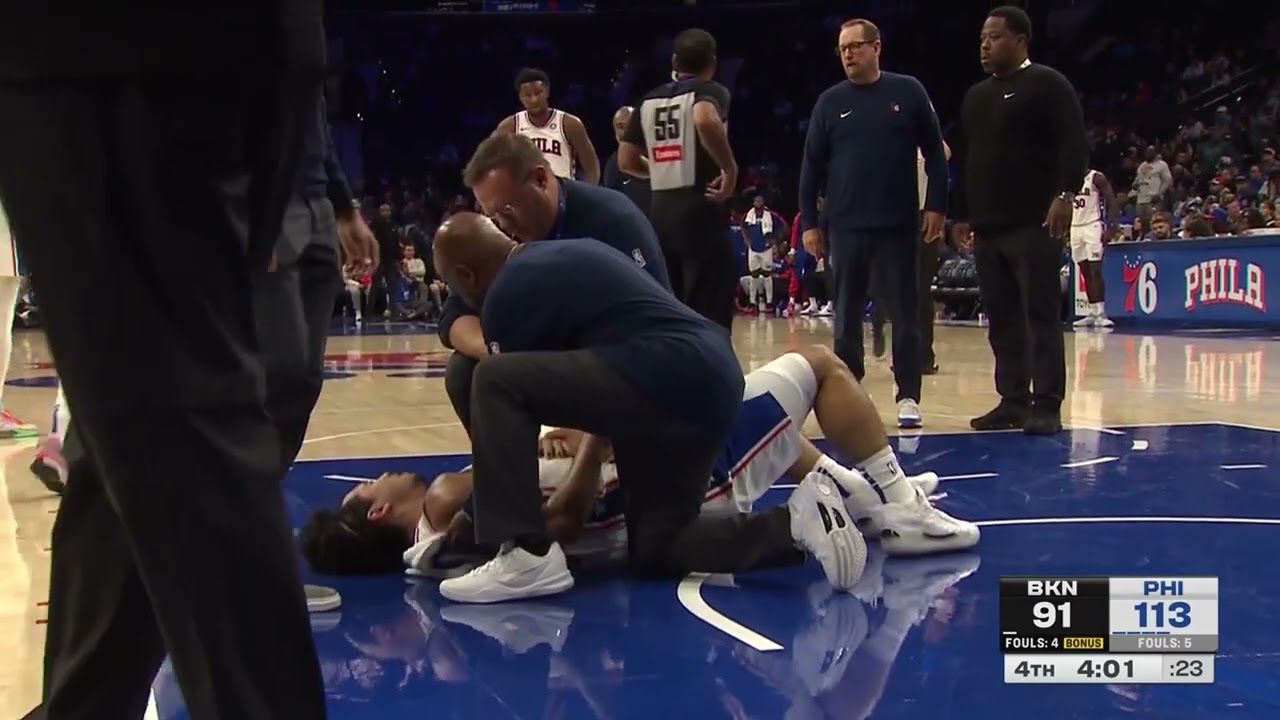 Jared McCain has to be helped off the court after a scary fall against the Nets!