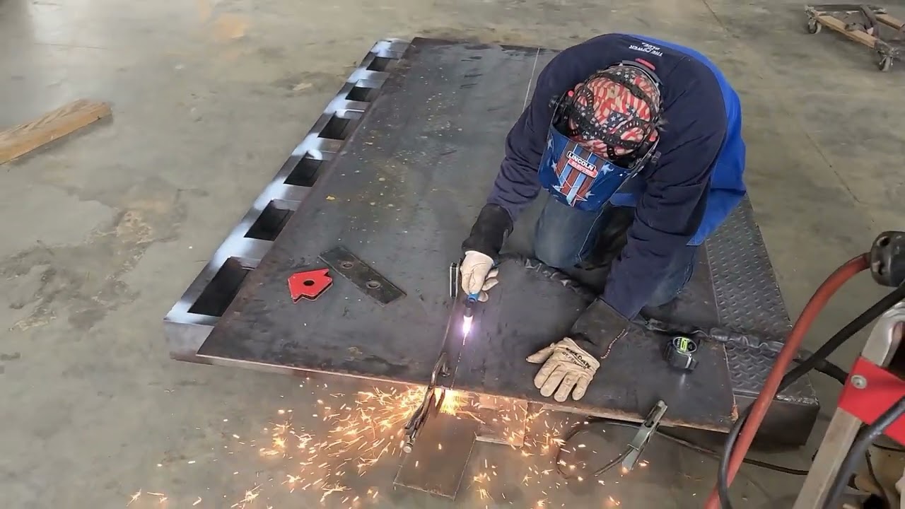 Fabrication and installation of a new hydraulic Dovetail on flat bed semi truck. 