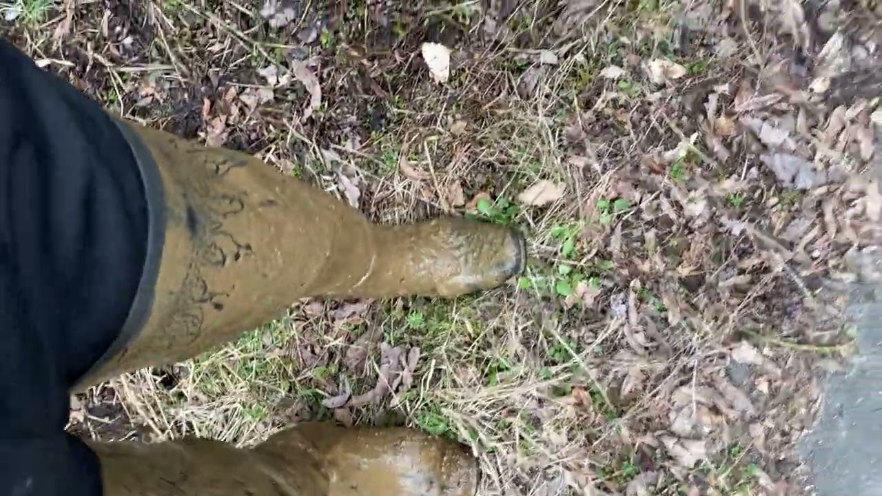 Muddy rubber boots.Acquo Manhattan 
