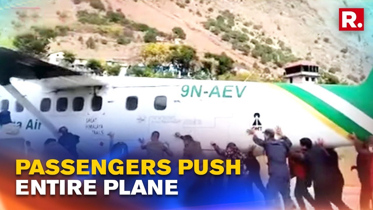 WATCH: Passengers, Airport Authorities Push An Airplane Off The Runway In Nepal