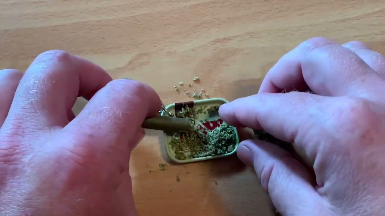 Rolling a little King Palm blunt on a tiny Raw keychain rolling tray