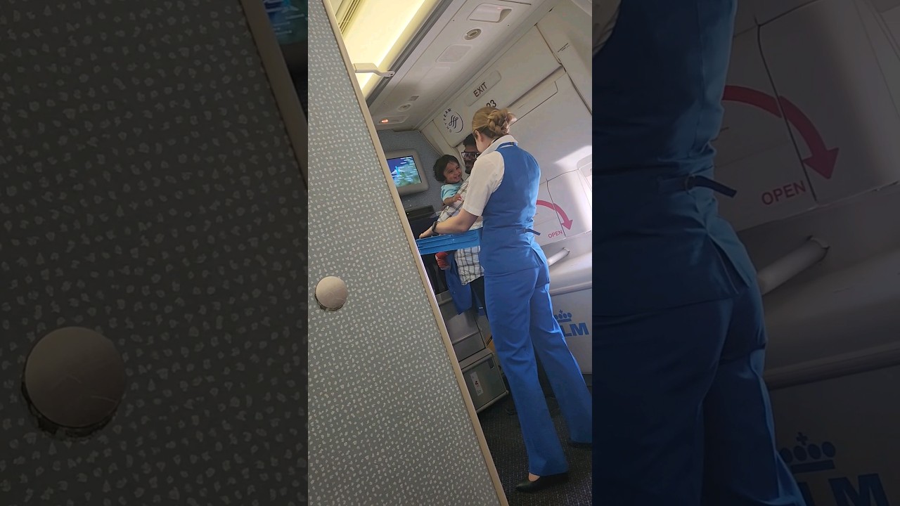 KLM Dutch Airlines. International flight.  Caring Air hostess 