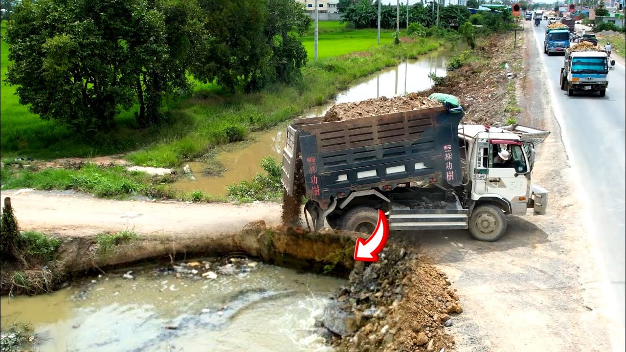 Great job !! Dump truck 25Ton unloading stone repair road and skill operator bulldozer pushing stone