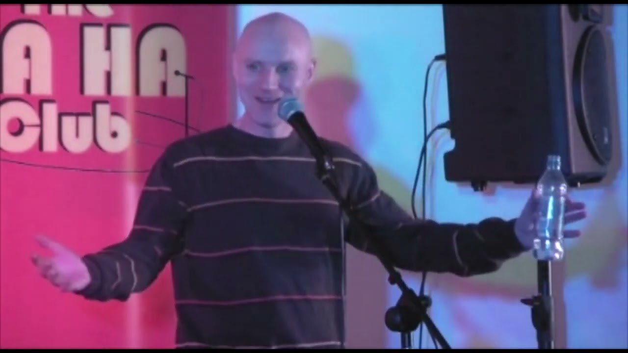 Tony Burgess Stand Up Clip - from 2011. End of the gig and someone drops a perfectly timed bottle.