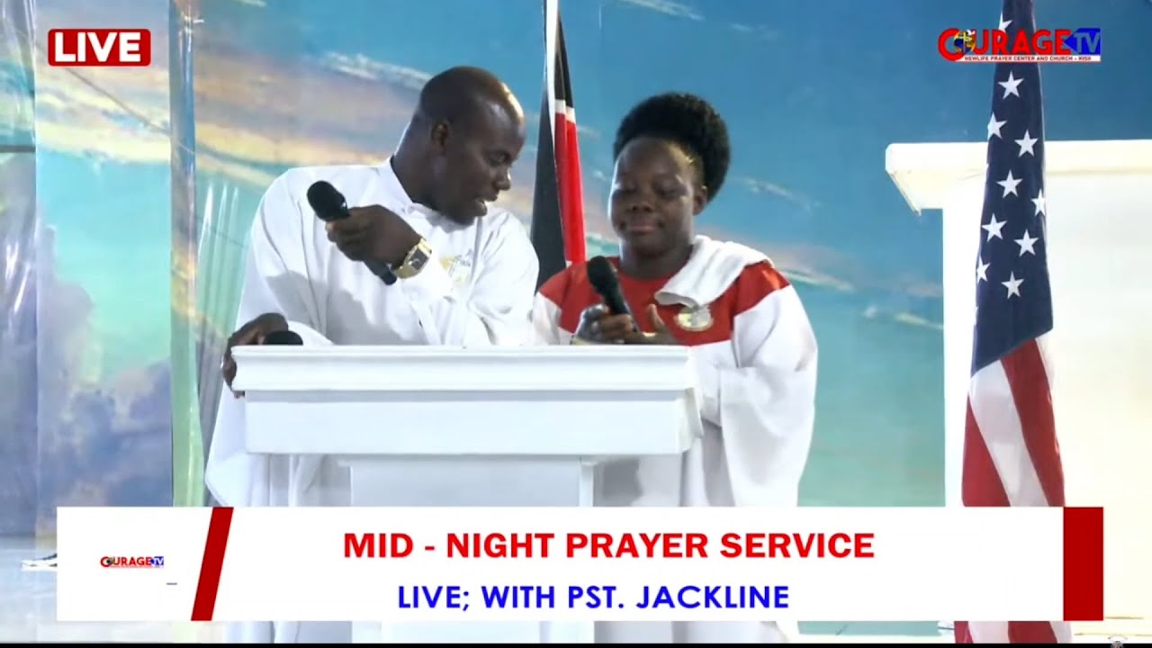 PASTOR GILLACK INTRODUCING PST. JACKLINE TO THE ALTAR FOR A MIDNIGHT PRAYER SERVICE.