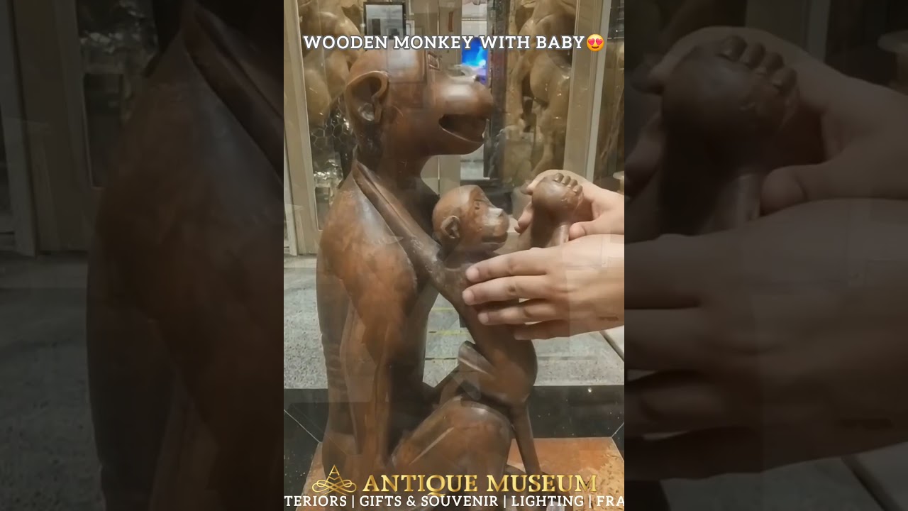 This wooden mother-and-baby sculpture adds emotion, elegance. 