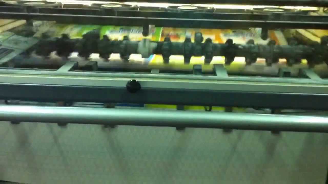salida de papel en m&aacute;quina offset
