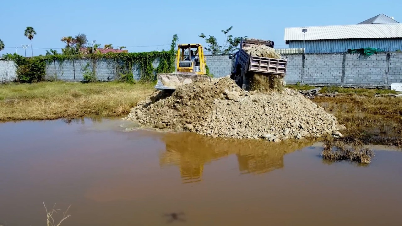 New Project Completed first step Dozer 31PX   Truck 5ton Pushing Stone Drop Into Water To Make Road